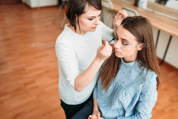 Female make up artist work with woman face Stock Photo by NomadSoul1