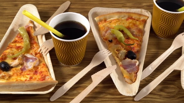 Slices of Pizza on Wooden Plates. Party Concept.