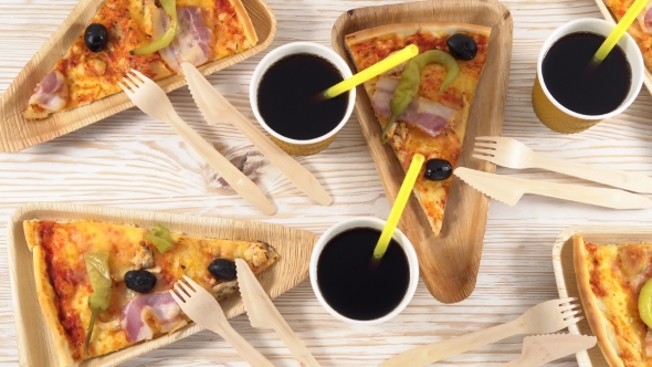 Slices of Pizza on Wooden Plates. Party Concept.