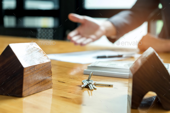 Sales are selling home. There are documents with the replica and - Stock Photo - Images