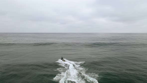 Jet ski in the sea during a storm surge, rescuing a big wave surfer, Pichilemu, Punta de Lobos Chile alt
