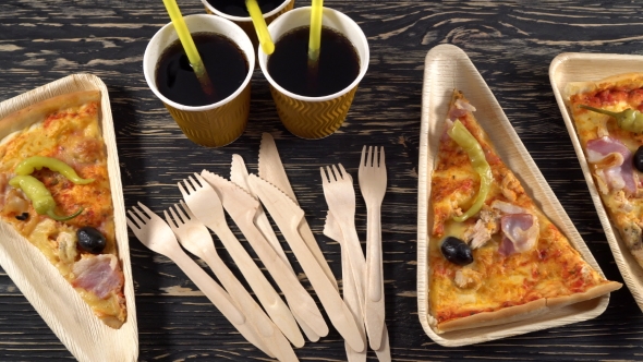 Slices of Pizza on Wooden Plates. Party Concept.