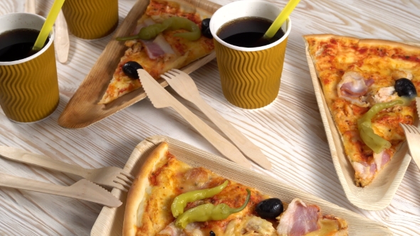 Slices of Pizza on Wooden Plates. Party Concept.