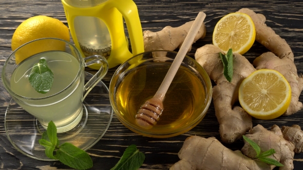 Ginger Tea with Lemon, Mint and Honey on Wooden Background.