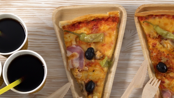 Slices of Pizza on Wooden Plates. Party Concept.