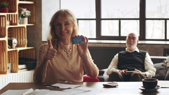 Elegant Woman Learns How To Use a Credit Card alt