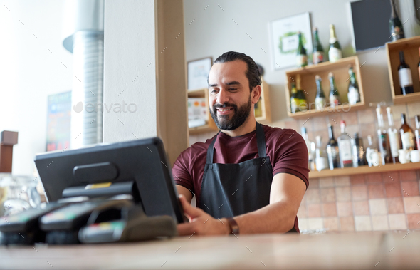 happy man or waiter at bar cashbox - Stock Photo - Images