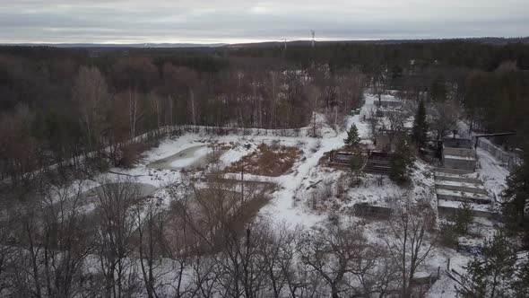 Drone Is Flying Over Outbuilding in Forest Area in Winter Day