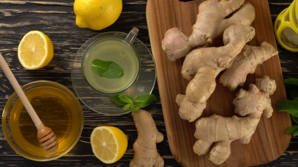 Ginger Tea with Lemon, Mint and Honey on Wooden Background.