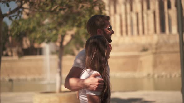 Couple Walking in Historic Town alt