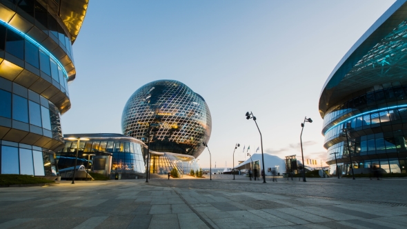 Of Modern Sphere Building With People Moving Around On Sunset Stock