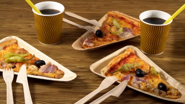 Slices of Pizza on Wooden Plates. Party Concept.