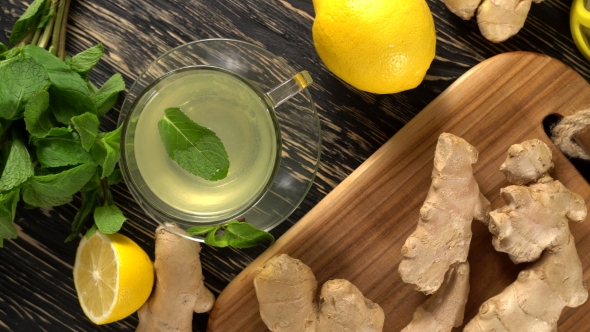 Ginger Tea with Lemon, Mint and Honey on Wooden Background.