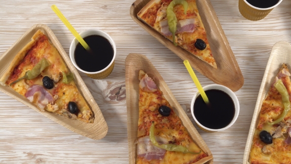 Slices of Pizza on Wooden Plates. Party Concept.