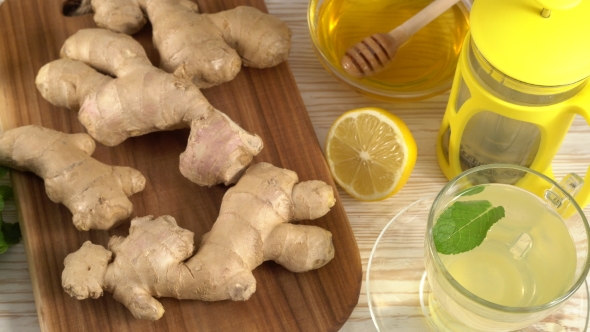 Ginger Tea with Lemon, Mint and Honey on Wooden Background.