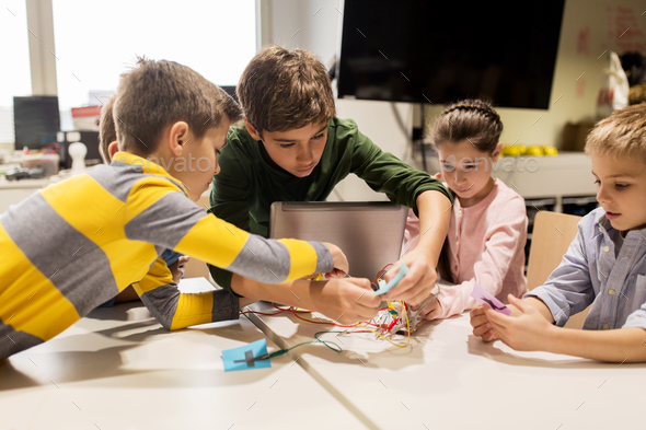 kids with invention kit at robotics school - Stock Photo - Images