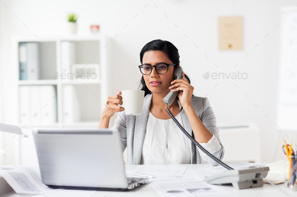 businesswoman calling on phone at office Stock Photo by dolgachov |  PhotoDune