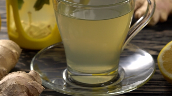 Ginger Tea with Lemon, Mint and Honey on Wooden Background.