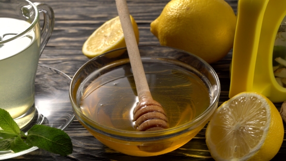 Ginger Tea with Lemon, Mint and Honey on Wooden Background.