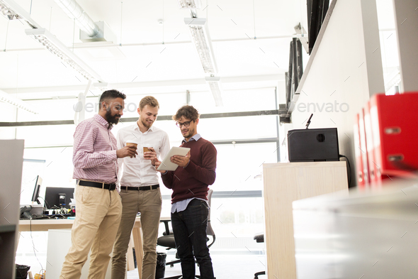 business team with tablet pc and coffee at office - Stock Photo - Images