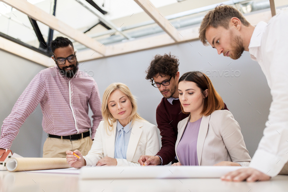 business team discussing house project at office - Stock Photo - Images