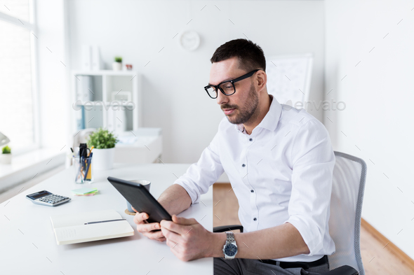 businessman with tablet pc at office - Stock Photo - Images