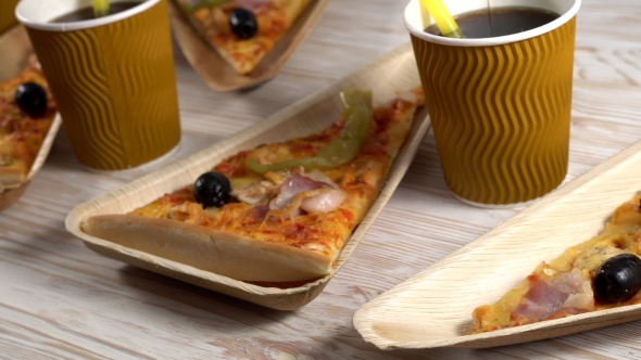 Slices of Pizza on Wooden Plates. Party Concept.