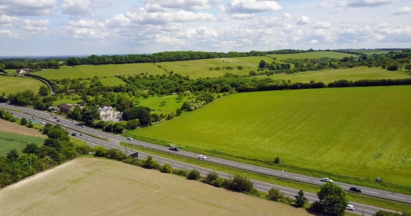 Dual Carriageway with Green Fields and Blue Sky alt