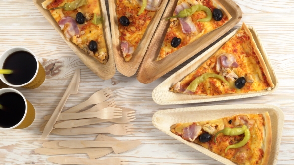 Slices of Pizza on Wooden Plates. Party Concept.