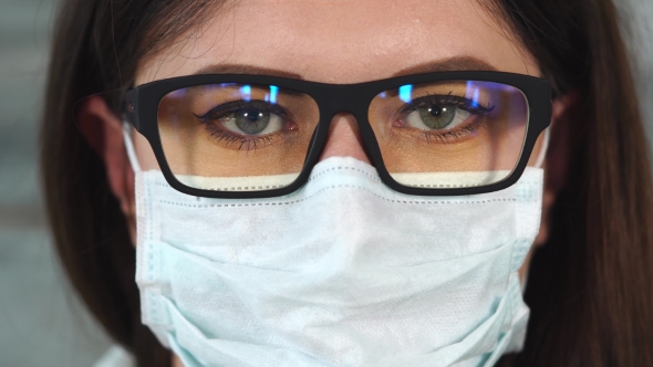 Shot of a Woman Wearing Glasses, She Is a Nurse or a Doctor alt