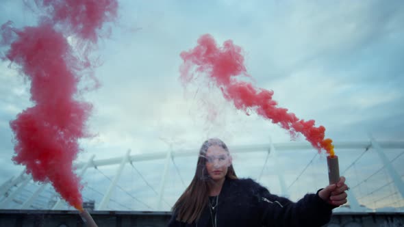 Girl Standing on City Street with Smoke Grenades, Hipster Posing at Camera alt