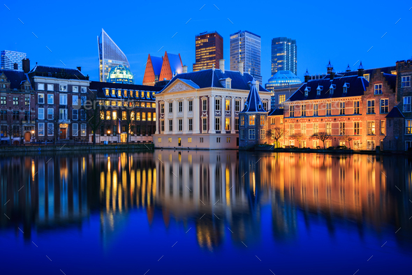 The skyline of the Hague and a lake at Blue Hour - Stock Photo - Images