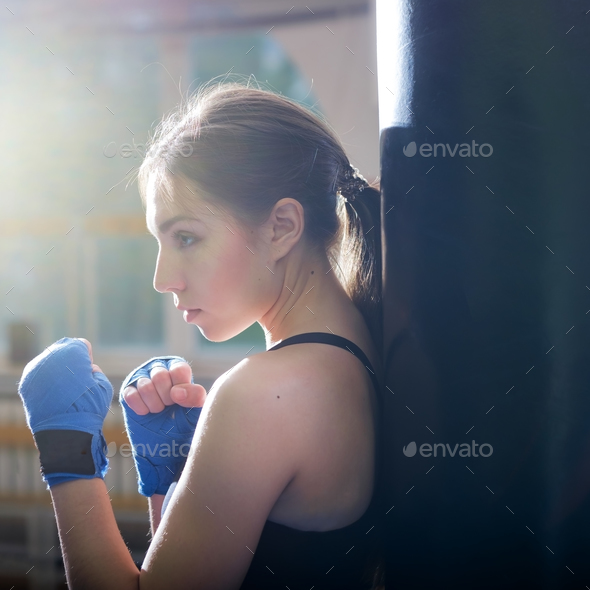 Young adult sexy boxing girl posing with gloves. Stock Photo by koldunov