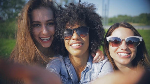 Beautiful Women Posing at Camera Outside alt