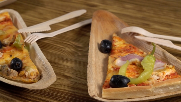 Slices of Pizza on Wooden Plates. Party Concept.