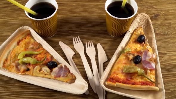 Slices of Pizza on Wooden Plates. Party Concept.