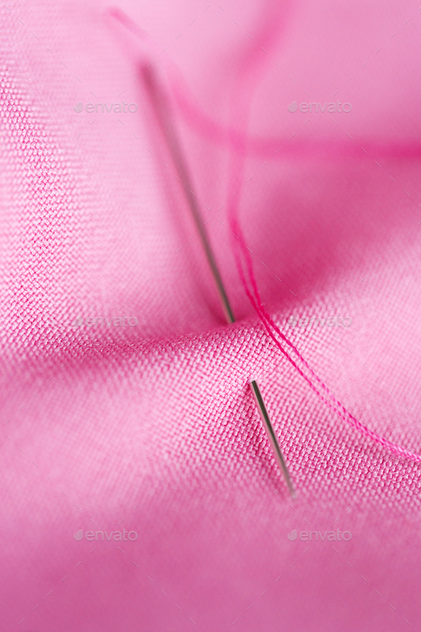 pink thread with needle, Stock image