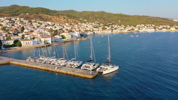 Catamaran and Sail Yachts Anchored at Spetses Marina Seaport alt