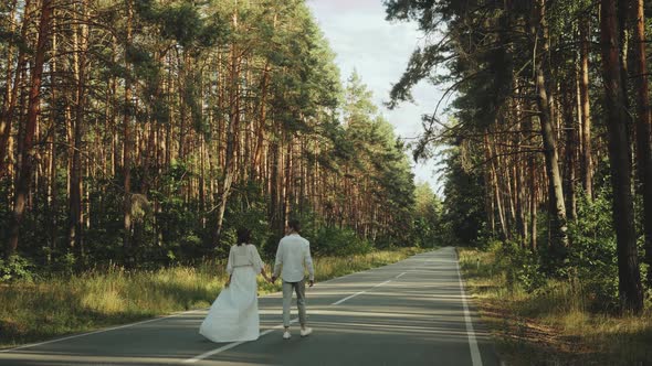 Hipster Couple in Love Walk in Beautiful Place Hold Hands Man and Woman Hugging and Enjoying alt