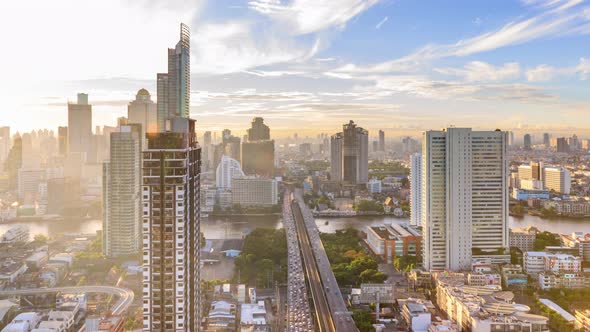 Bangkok traffic on Taksin bridge over Chao Phraya river in morning - time lapse