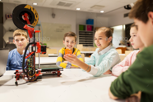 happy children with 3d printer at robotics school - Stock Photo - Images
