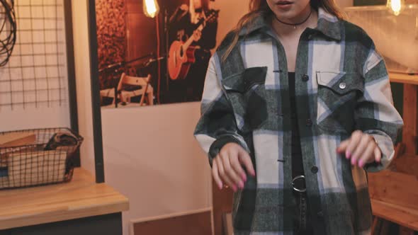 Rock-n-Roll Woman Playing Synth In Studio alt