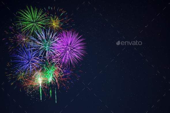 Beautiful gree purple blue red fireworks copy space - Stock Photo - Images