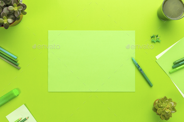 Environmental concept of a green office desk with supplies - Stock Photo - Images