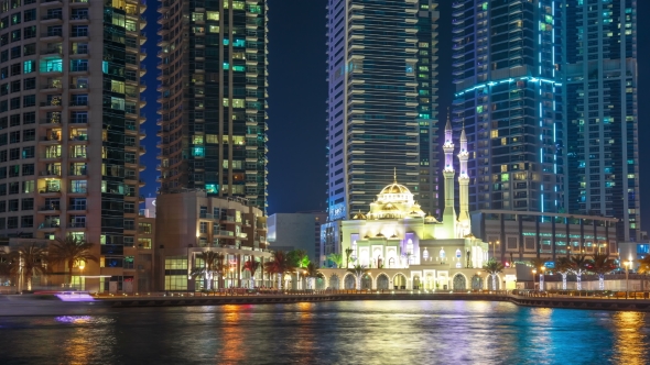 White Mosque Among Skyscrapers in the Harbor Area of Dubai Marina alt