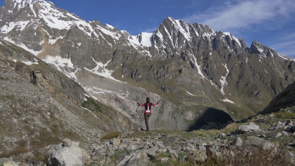 Woman in Yoga Pose in High Mountains