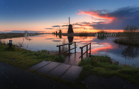 Silhouette of windmills at sunrise in Kinderdijk, Netherlands - Stock Photo - Images