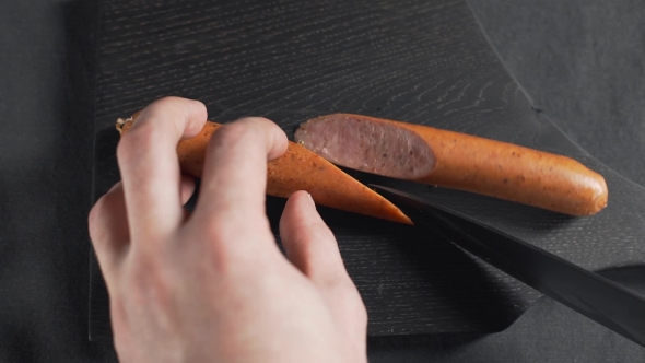 VideoHive The Cook Cuts Sausage By Sharp Knife on the Wooden Board Fas Food Cooking Sausages and Meat 20209800 VideoHive The Cook Cuts Sausage By Sharp Knife on the Wooden Board Fas Food Cooking Sausages and Meat 20209800