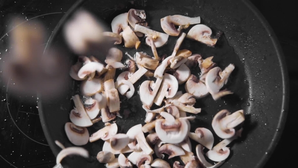 VideoHive Raw Mushrooms Falls Down on the Frying Pan Roasted Champignones Vegetarian Meal Cooking Food 20209884 VideoHive Raw Mushrooms Falls Down on the Frying Pan Roasted Champignones Vegetarian Meal Cooking Food 20209884
