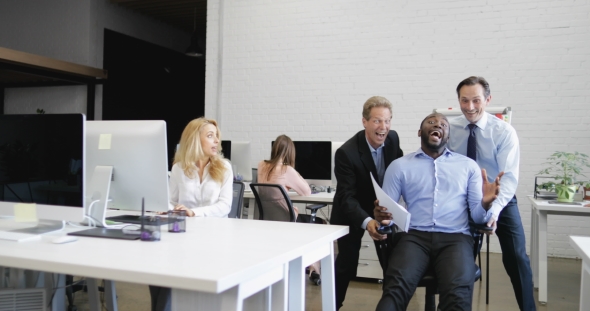 Cheerful Business Men Riding African American Colleague On Office Chair, Male Businesspeople Group alt